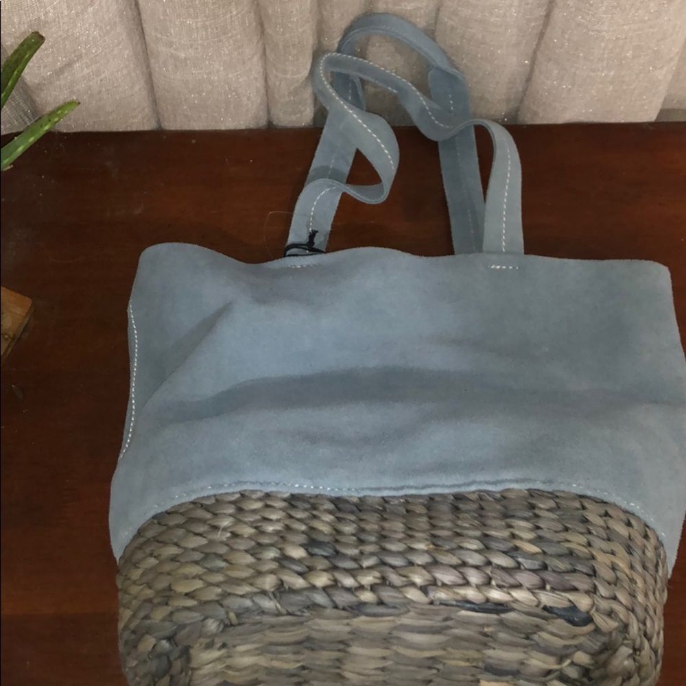 sky blue suede and straw bottom handbag
